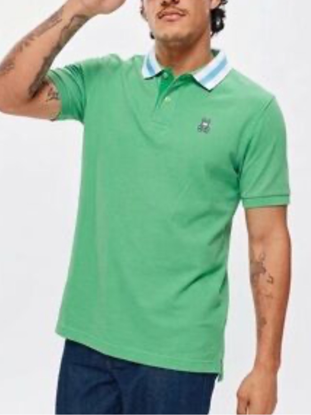 Psycho Bunny Polo features a vibrant green fabric brightly tipped collar xl